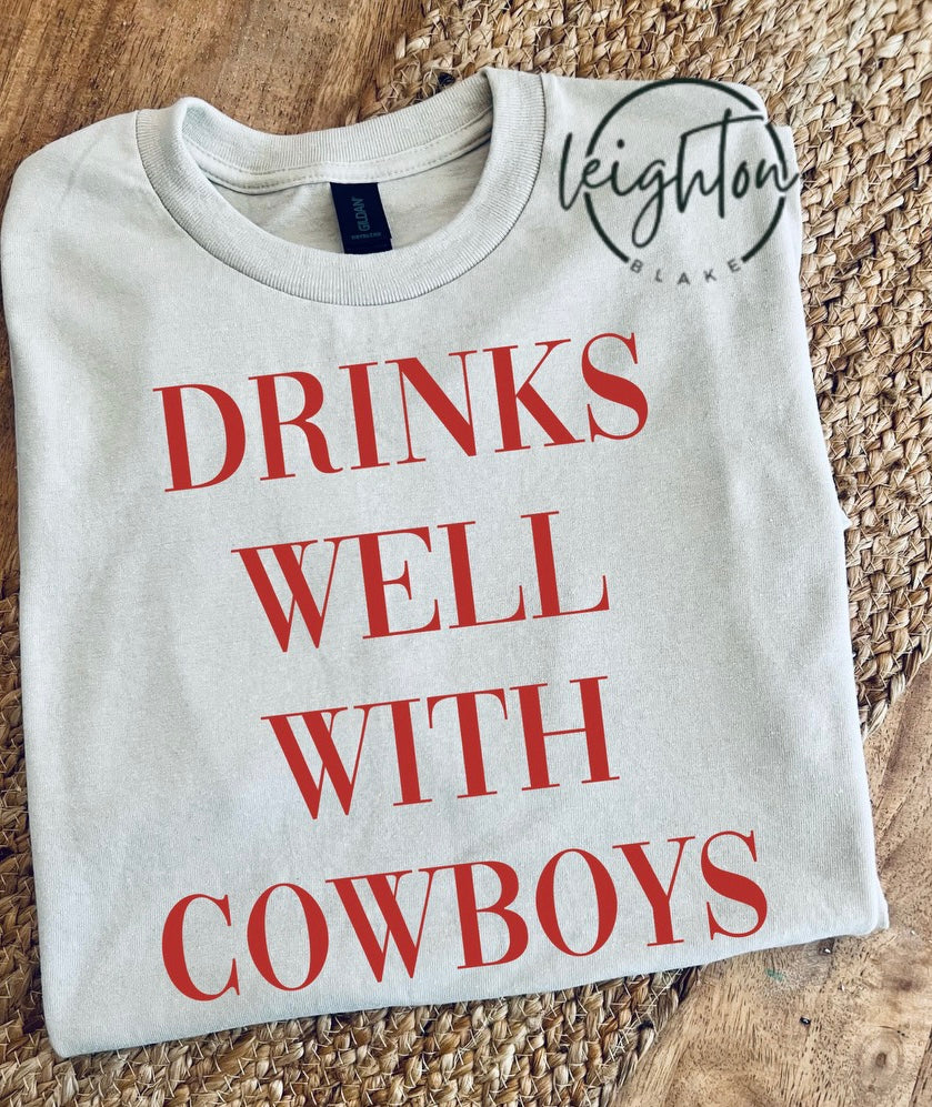 Drinks Well With Cowboys Tee